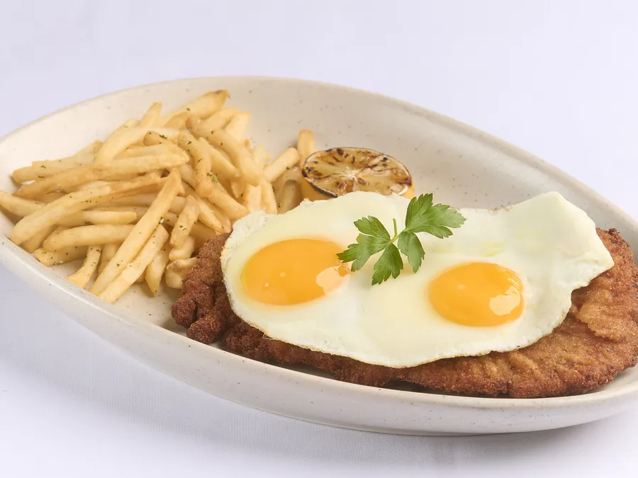 Chicken Or Beef Milanesa A Caballo at Malbec Grill, Argentinian steakhouse in Parkland FL
